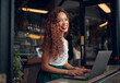 © Kay Abrahams/peopleimages.com - African woman, laptop and remote work at restaurant writing novel, digital content research or technical copywriter. Happy girl, entrepreneur and freelance worker or planning day at restaurant