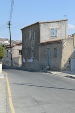 Vertical Of Old Rundown Buildings In A Cypriot Village.
