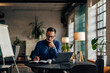 © bnenin - Focused businessman writing something in the notebook, making plans.