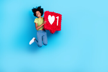 Sticker - Full body size photo of funny dreamy air trampoline jumping teenager hold red paper banner popular social media person isolated on bright blue color background