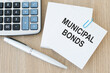 © Volha - Business concept.Text MUNICIPAL BONDS the card on the table