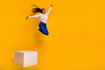 Canvas Print - Full length body size view of attractive cheery trendy girl jumping from stage action isolated over bright yellow color background