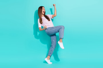 Wall Mural - Full size photo of nice ecstatic woman dressed striped t-shirt eyes closed scream yes clench fists isolated on teal color background