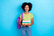 © deagreez - Portrait of impressed ecstatic girl green t-shirt hold book rucksack unbelievable unexpected reaction isolated on blue color background