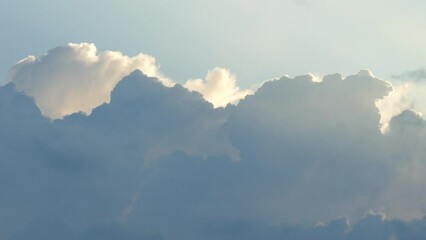 Wall Mural - A beautiful calming time lapse of a cloudscape with white blue and orange tones. 