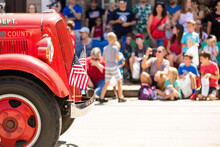 Small Town Fourth Of July Parade, Vintage Firetruck With American Flags