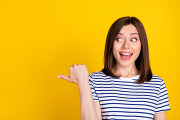 Wall Mural - Closeup photo of young cute woman finger looking empty space unexpected how prices low supermarket isolated on yellow color background