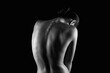 Nude silhouette of spine. Naked Woman. Beautiful Back. Black and white photo