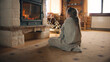 Young girl sitting by the fireplace on mild carpet, watching on fire and warming by coverlet in cold days, relaxing and spending leisure time at home