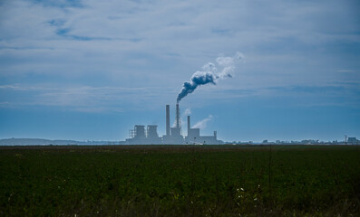 Wall Mural - The chimney of a thermal power plant, the smoke extracted by a thermal power plant on the chimney, in the production process. Environment. Pollution.