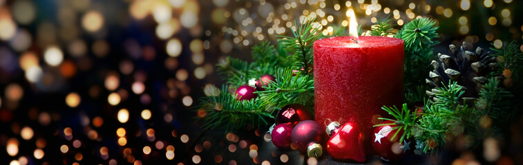 Christmas Background banner with red advent candle and magic bokeh lights - xmas greeting card, panorama , header