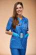 Doctor woman in blue medical suit. Isolated portrait of nurse.