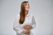 Happy healthy woman has no stomach problems. isolated portrait on white.