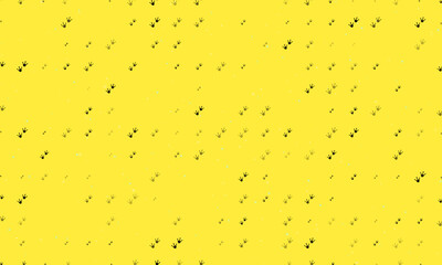 Poster - Seamless background pattern of evenly spaced black frog tracks symbols of different sizes and opacity. Vector illustration on yellow background with stars