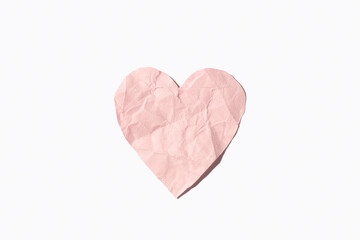 Wall Mural - Pink crumpled paper heart isolated on white background