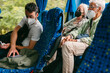 © Jimena Roquero/Stocksy - Group of people traveling on bus