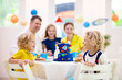 © famveldman - Kids space theme birthday party with cake.