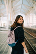 © Olga Moreira/Stocksy - Portrait of a young female student on train station