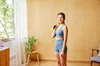 © ALTO IMAGES/Stocksy - Cheerful young sportswoman with kettlebell