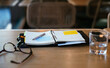 © BONNINSTUDIO/Stocksy - Notepad on table in restaurant
