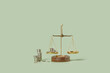 © Yaroslav Danylchenko/Stocksy - Silver coins weighed on balanced scales.