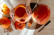 © Sergey Narevskih/Stocksy - Crop woman touching pumpkin prepared to Halloween