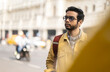 © Dream Lover/Stocksy - Portrait of an Indian man wearing yellow denim jacket at outdoors