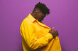 © VICTOR TORRES/Stocksy - Young trendy man looking at his outfit