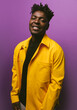 © VICTOR TORRES/Stocksy - Cheerful black man in trendy outfit