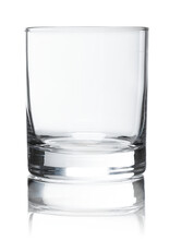 Empty glass for whiskey on white background.