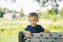 Little Boy On A Bench