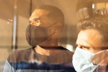 Men with face mask in home during the COVID-19 pandemic