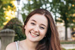 © Pedro Merino/Stocksy - Portrait of a young redhead woman smiling looking at camera