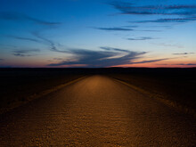 A Gravel Road At Night.