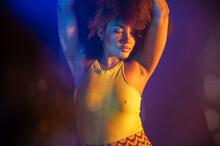 African American Model Under Colorful Neon Illumination