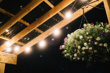 Flower Arrangement And Patio Roof At Night