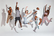 © BONNINSTUDIO/Stocksy - Multiracial sportspeople jumping with raised arms
