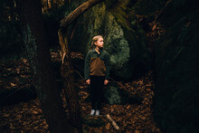 Girl In Fleece In The Woods
