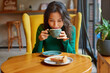© olga pink - Portrait of young Asian woman drinking coffee witn apple pie in cafe