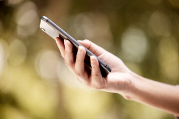 Wall Mural - Hands, bokeh and social media communication with 5g technology connection outside close up. Tech leisure entertainment person holding smartphone with networking app and internet connectivity.