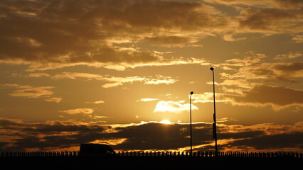Wall Mural - the beautiful sunset view with the colorful clouds and sky in the city