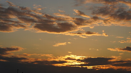 Wall Mural - the beautiful sunset view with the colorful clouds and sky in the city