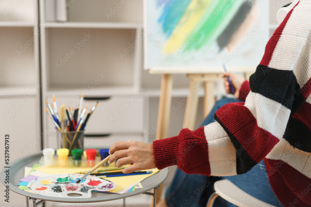 The art concept, Asian female artist smiling to happy while using brush ...