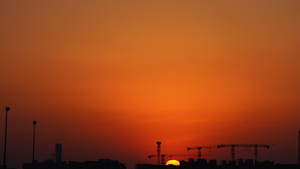 Wall Mural - the beautiful sunset view with the colorful clouds and sky in the city