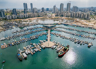 Ashdod city complete beautiful panoramic aerial view from the sea showing it modern marina symmetric open landscape and sky scrapers in the distance with overcast skies