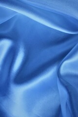 Wall Mural - Beautiful light blue fabric, folded in soft folds. Silk, satin or satin.
