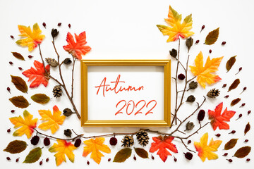 Wall Mural - colorful autumn leaf decoration, golden frame, text autumn 2022