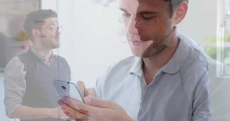 Poster - Animation of caucasian man using smartphone over diverse business people in office