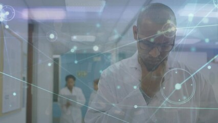 Poster - The video features a scientist using a digital tablet in their office