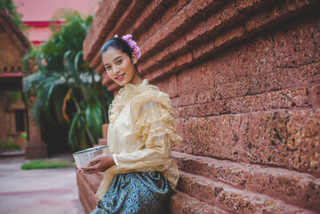 Wall Mural - Portrait beautiful woman in Songkran festival with Thai Traditional costume